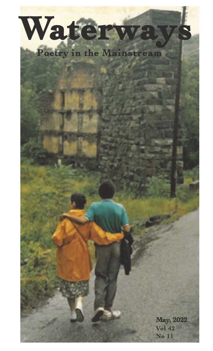 photograph of couple walking down a country road